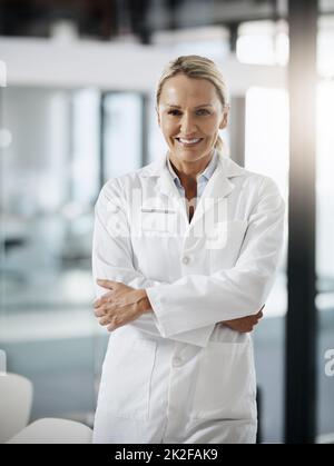 Im confident in my scientific research. Cropped portrait of an attractive mature female scientist standing with her arms folded in her lab. Stock Photo