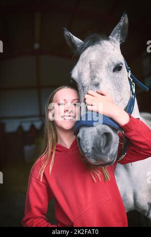 More than a horse, shes my best friend. Shot of a teenage girl bonding with her horse. Stock Photo