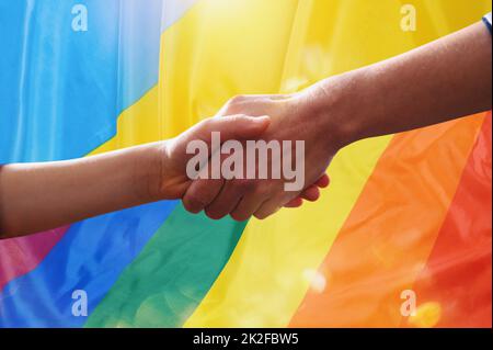 Sunny Ukraine and peace flag with helping hand as support Stock Photo