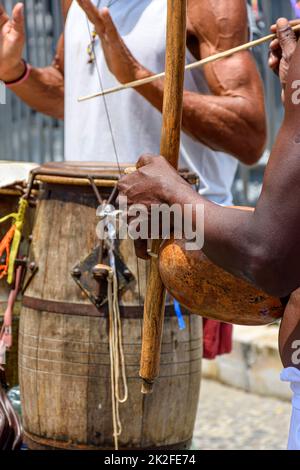 Musicians playing handmade instruments used in capoeira in Salvador, Bahia Stock Photo