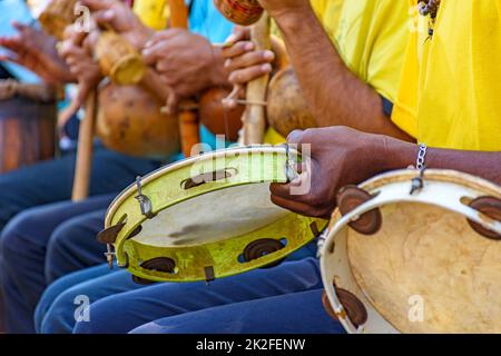 Tambourine, berimbau and others instruments player during presentation of Brazilian capoeira Stock Photo