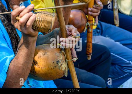 Traditional berimbau players during presentation of Brazilian capoeira Stock Photo