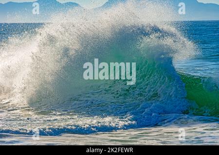 Wave breaking at beach Stock Photo