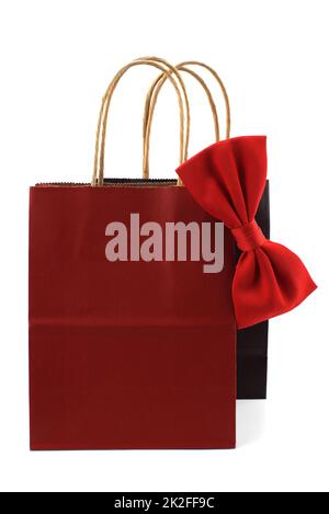 Black and red paper shopping bags with red bow tie Stock Photo