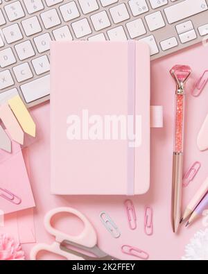 Notebook, Pink school girly accessories and keyboard on pastel pink Top view, mockup Stock Photo