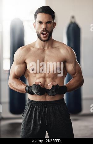 Boxing, strong and boxer man portrait in training workout or fitness gym. Muscle strength, body goals and determined personal trainer athlete during Stock Photo