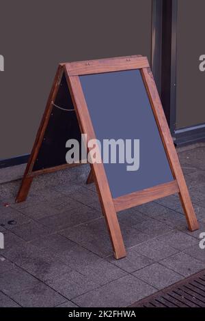 Blackboard in front of coffee shop Stock Photo