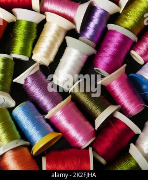 close-up colorful threads,craft threads,colorful lace knitting threads wound on spools Stock Photo