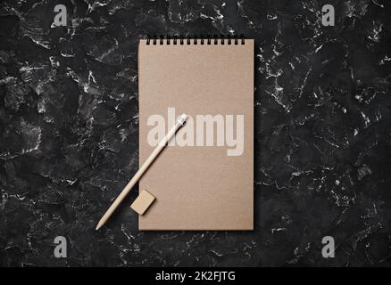 Spiral notebook, pencil, eraser Stock Photo