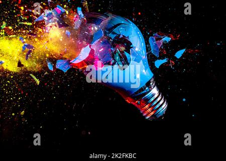 colorful electric light bulb exploding Stock Photo