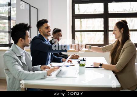 Businesspeople Shaking Hands After Interview Stock Photo