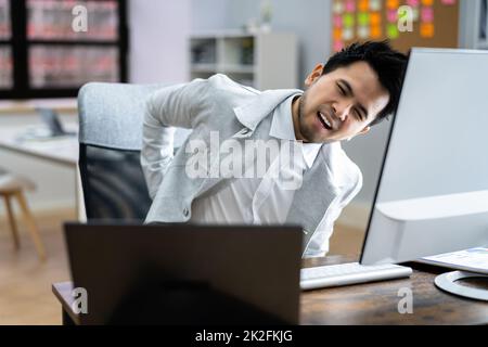 Back Pain Bad Posture Man Sitting Stock Photo