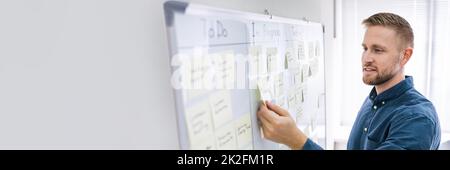 Businessman Writing On Sticky Notes Stock Photo