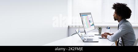 Analyst Employee Working With Spreadsheet Stock Photo