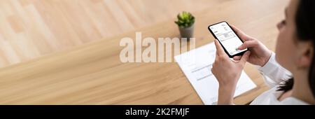 Taking Invoice Document Photo Using Phone Stock Photo