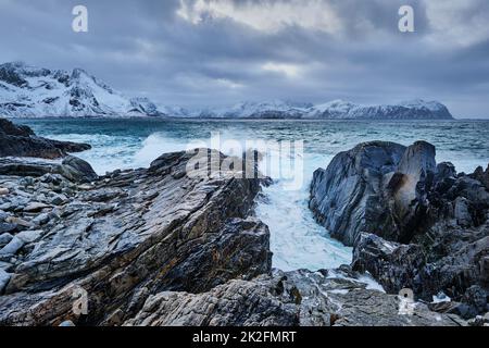 Norwegian Sea waves on rocky coast of Lofoten islands, Norway Stock Photo