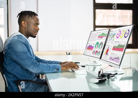 African Advisor Using KPI Dashboard Stock Photo