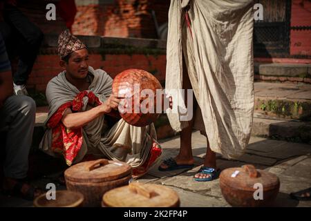 Nepal. 23rd Sep, 2022. People from Raute community waits fro the customer to ells their wooden crafts in the ''˜Raute Exhibition' program held at Bhaktapur on Friday. The last nomadic ethnic group of Nepal, Raute are known for living in forest and hunting monkeys. They are one of the endangered community of South Asia. They live in temporary tents in remote parts of the forest. While they have a talent for crafting wood and creating striking household utensils, they use it to barter for food-grains with the local people. At present, government provides them certain amount as social secu Stock Photo