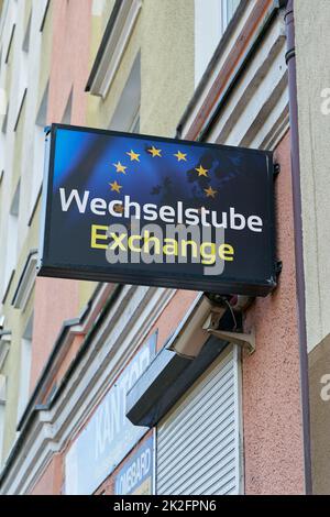Illuminated sign of an exchange office for tourists in the center of Kolobrzeg in Poland Stock Photo