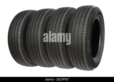 Four summer tires for car isolated on white. Stock Photo