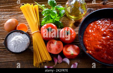 Composition with dried spaghetti, and pasta ingredients Stock Photo