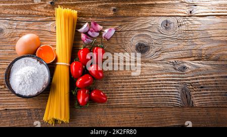 Composition with dried spaghetti, and pasta ingredients Stock Photo