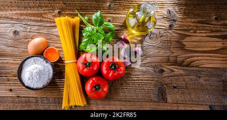 Composition with dried spaghetti, and pasta ingredients Stock Photo
