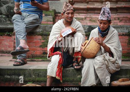 Nepal. 23rd Sep, 2022. People from Raute community waits for the customer to sell their wooden crafts in the ''˜Raute Exhibition' program held at Bhaktapur on Friday. The last nomadic ethnic group of Nepal, Raute are known for living in forest and hunting monkeys. They are one of the endangered community of South Asia. They live in temporary tents in remote parts of the forest. While they have a talent for crafting wood and creating striking household utensils, they use it to barter for food-grains with the local people. At present, government provides them certain amount as social secu Stock Photo