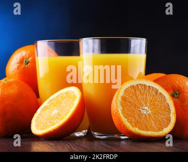 Glasses with freshly squeezed orange juice Stock Photo