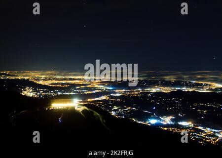 Plain illuminated partially covered by fog, soft lights Stock Photo