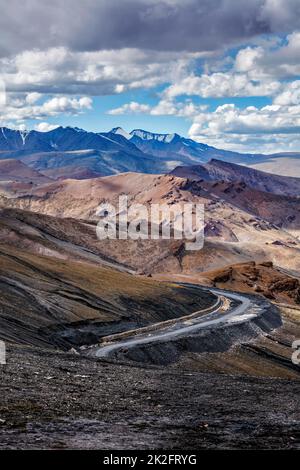 Road in Himalayas with mountains Stock Photo