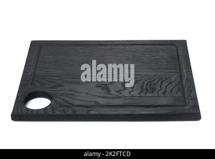 rectangular black wooden cutting kitchen board with a hole on a white isolated background Stock Photo