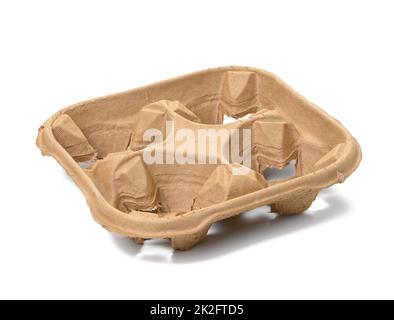 square cardboard holder made from recycled ecological raw materials for four cups of coffee or tea on a white isolated background Stock Photo