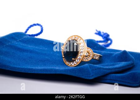 Blue Sapphire and Diamond Jewel or gems ring on velvet bag. Collection of natural gemstones accessories. Studio shot Stock Photo