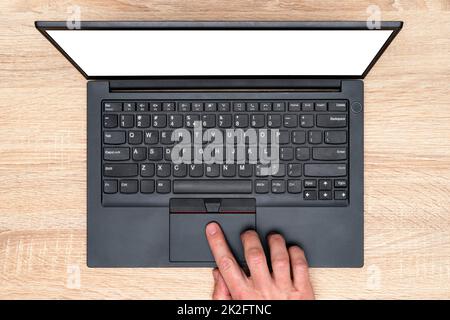 Hand working on a computer touchpad Stock Photo
