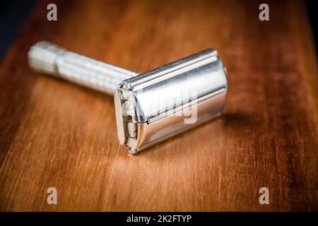 Old vintage shaver on a wooden background Stock Photo