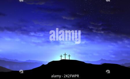 Three crosses on the hill with clouds moving on the blue starry sky Stock Photo