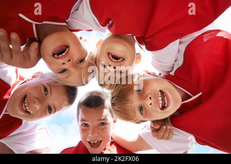 The field holds promise. Shot of a childrens soccer team. Stock Photo