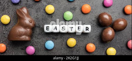 Delicious Easter chocolate bunny, eggs and sweets Stock Photo