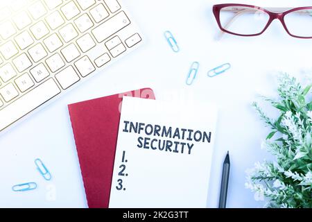 Hand writing sign Information Security. Word Written on INFOSEC Preventing Unauthorized Access Being Protected Stock Photo