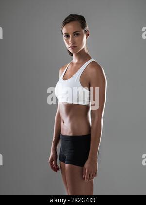 Hard workouts pay off. Shot of an attractive athletic woman wearing workout clothes. Stock Photo