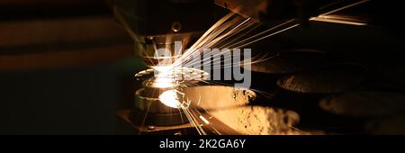 Laser cutting technology flat sheet metal steel material processing with sparks Stock Photo