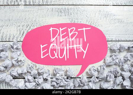 Text showing inspiration Debt Equity. Word for dividing companys total liabilities by its stockholders Stock Photo