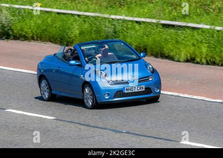 2007 Blue NISSAN MICRA CC SPORT 1598cc 5 speed manual; travelling on the M6 motorway, UK Stock Photo