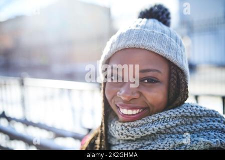 Winter looks great on her. Portrait of a beautiful young woman enjoying a wintery day outdoors. Stock Photo