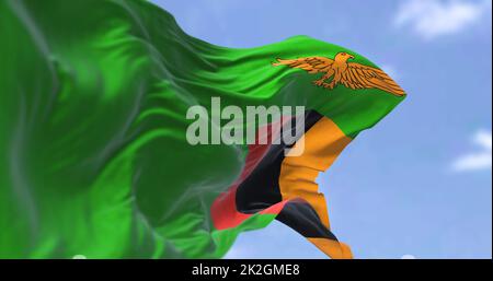 Detail of the national flag of Zambia waving in the wind on a clear day. Stock Photo