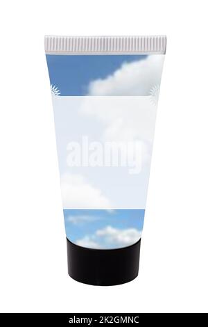 Beauty products container. Closeup of a bright cosmetic tube with a abstract designed transparent white label and cloudy blue sky for your own product and text. Isolated on white. Stock Photo