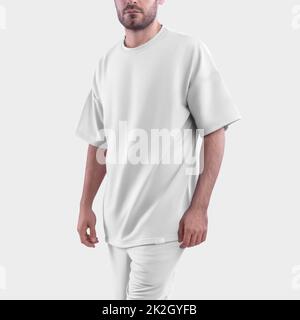 White Mockup of an oversized men's t-shirt for design, print, pattern. Template of fashionable clothes on isolated background. Stock Photo