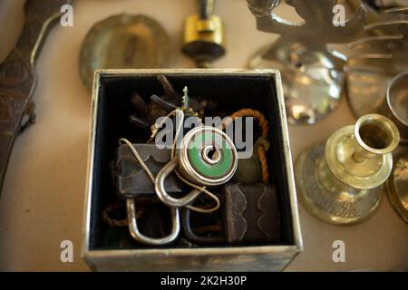 Old metallic rust locker on flea market into carton box. Turkey Stock Photo