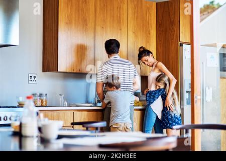 Our home truly is one of the happiest. Shot of a happy family bonding together at home. Stock Photo